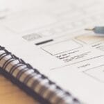 Free web design sketch ideas - a notebook with a pen on top of it