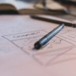 Mobile Wireframe - a pen on a piece of paper with a drawing of a house
