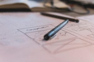 Mobile Wireframe - a pen on a piece of paper with a drawing of a house
